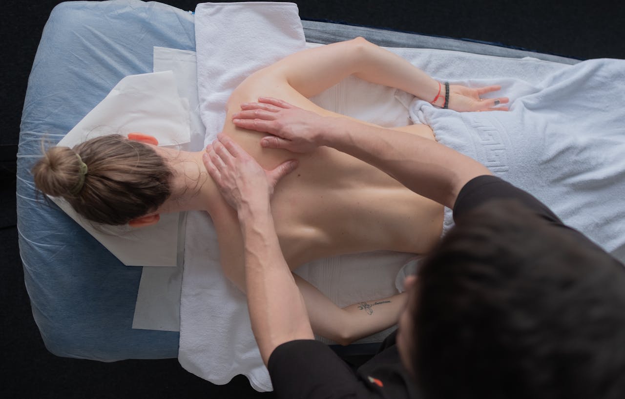 Top view of a relaxing massage session, focusing on calm and comfort.